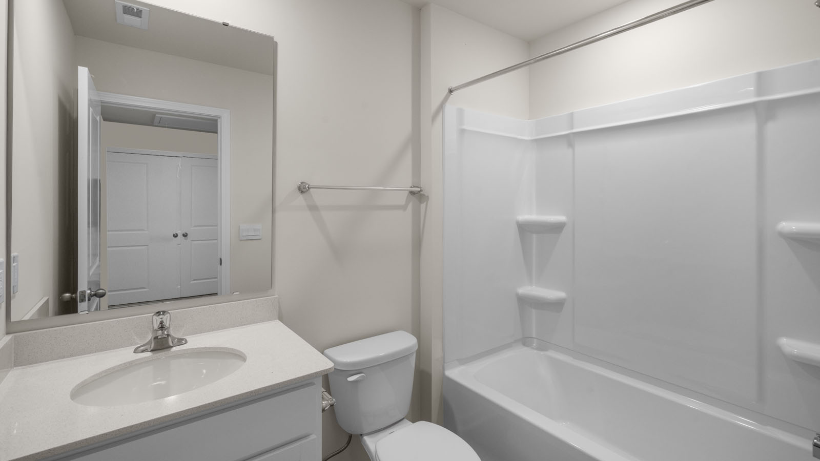 bathroom with a vanity sink, toilet and shower