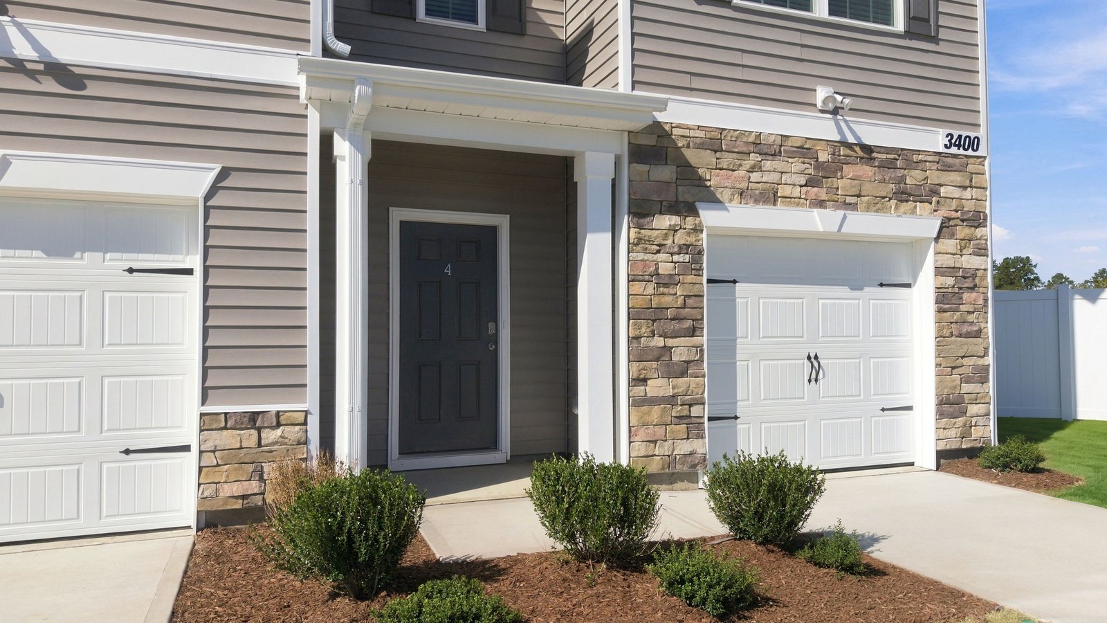 front view of townhome and driveway
