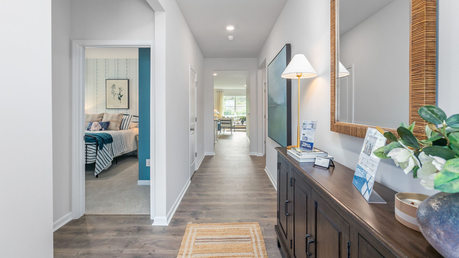 front entry way of home featuring brown flooring and white walls