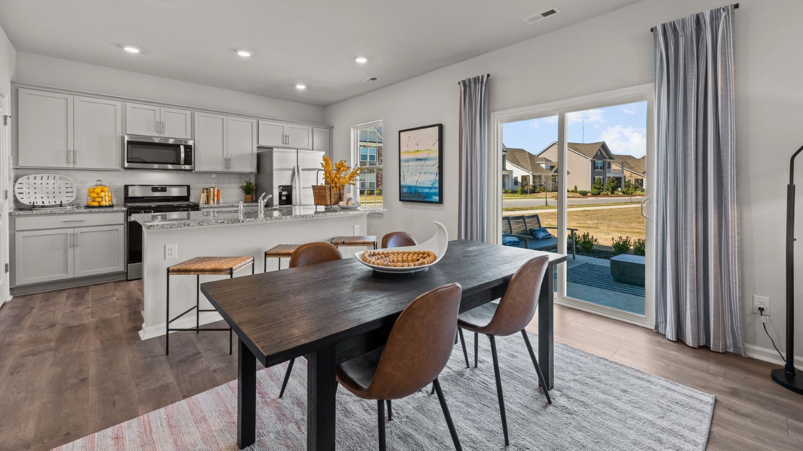 dining area and kitchen with sliding glass doors