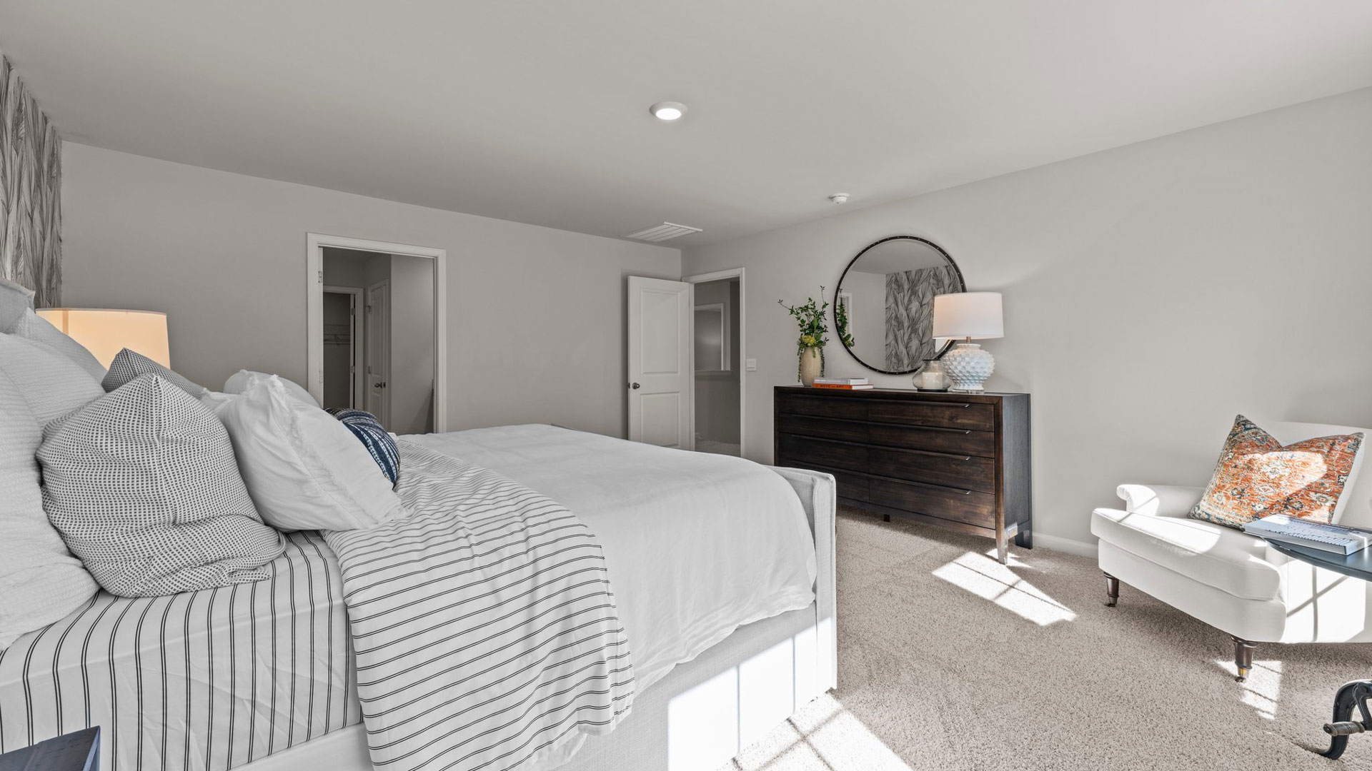 Primary bedroom with carpet flooring