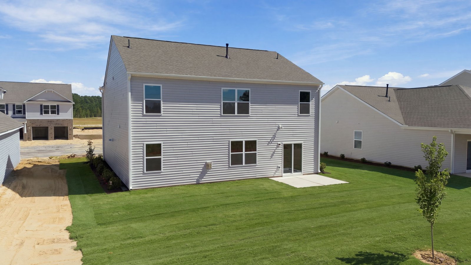 rear view of the home and back lot