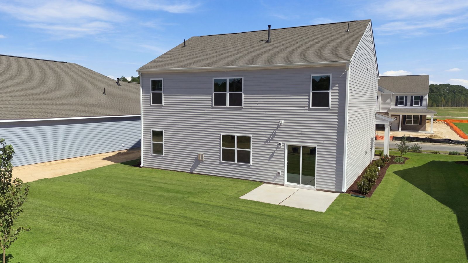 rear view of the home and back lot