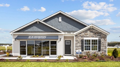 Single story home with brick and light blue exterior