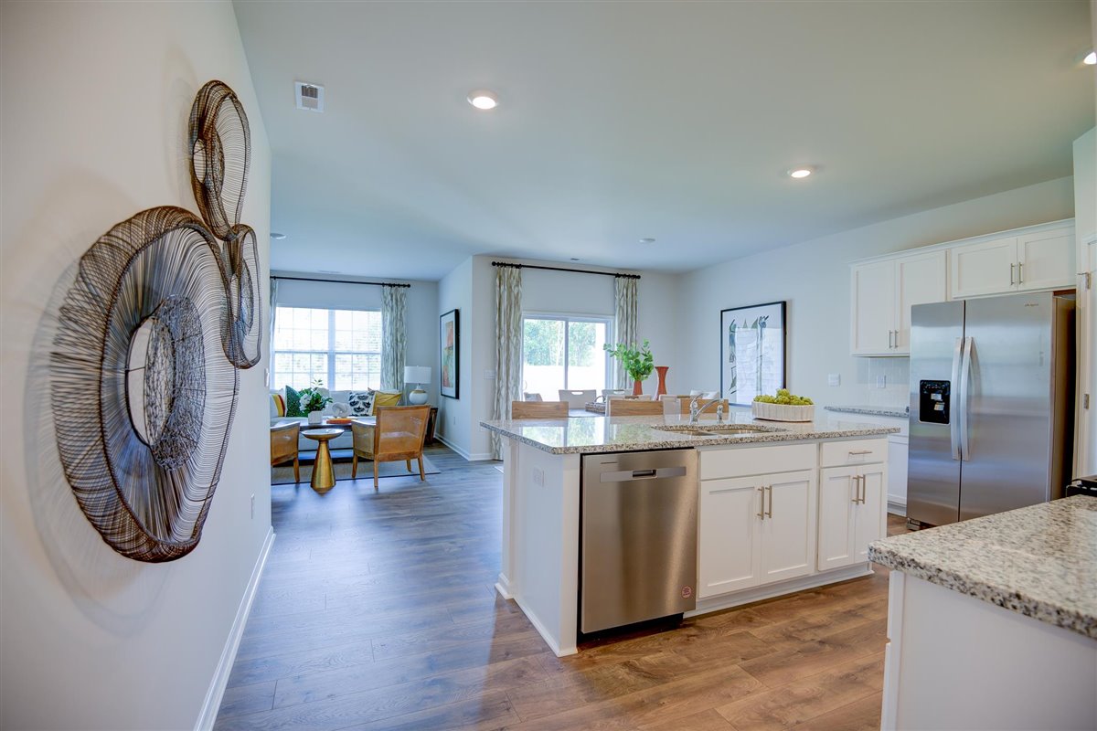 kitchen with white cabinetry, large island, and stainless steel appliances