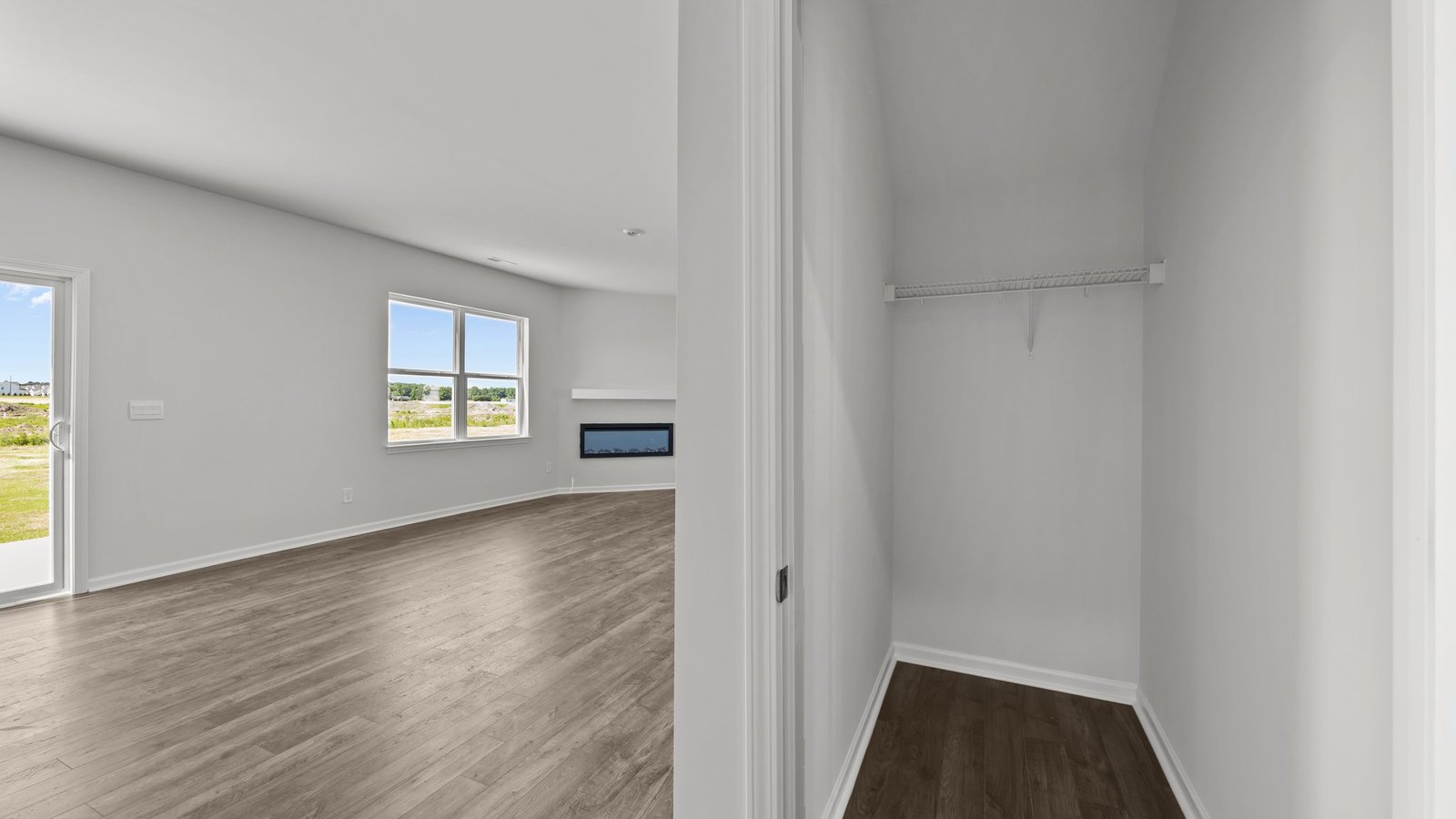 Open-concept living room with coat closet
