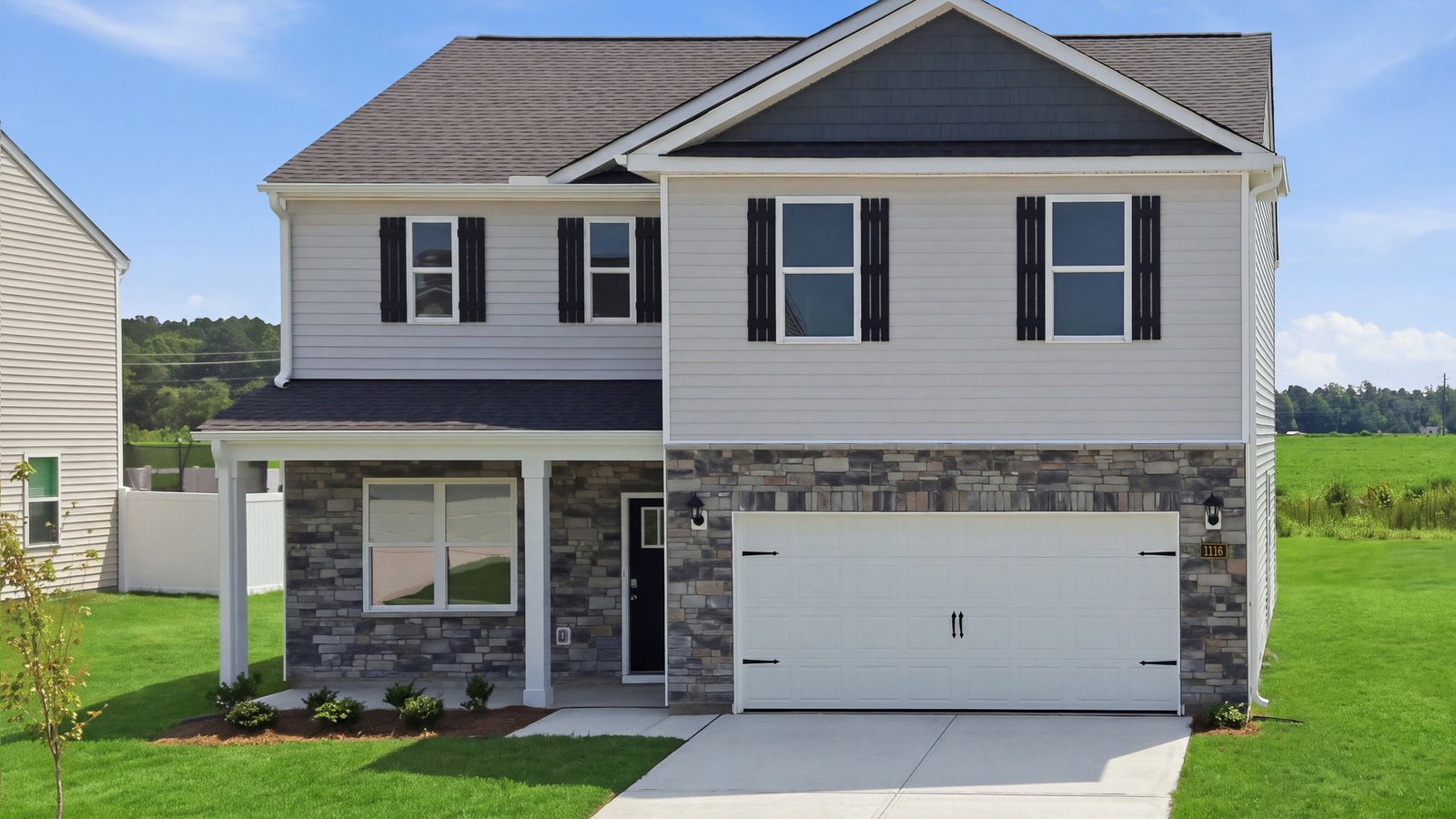 two story home with two car garage