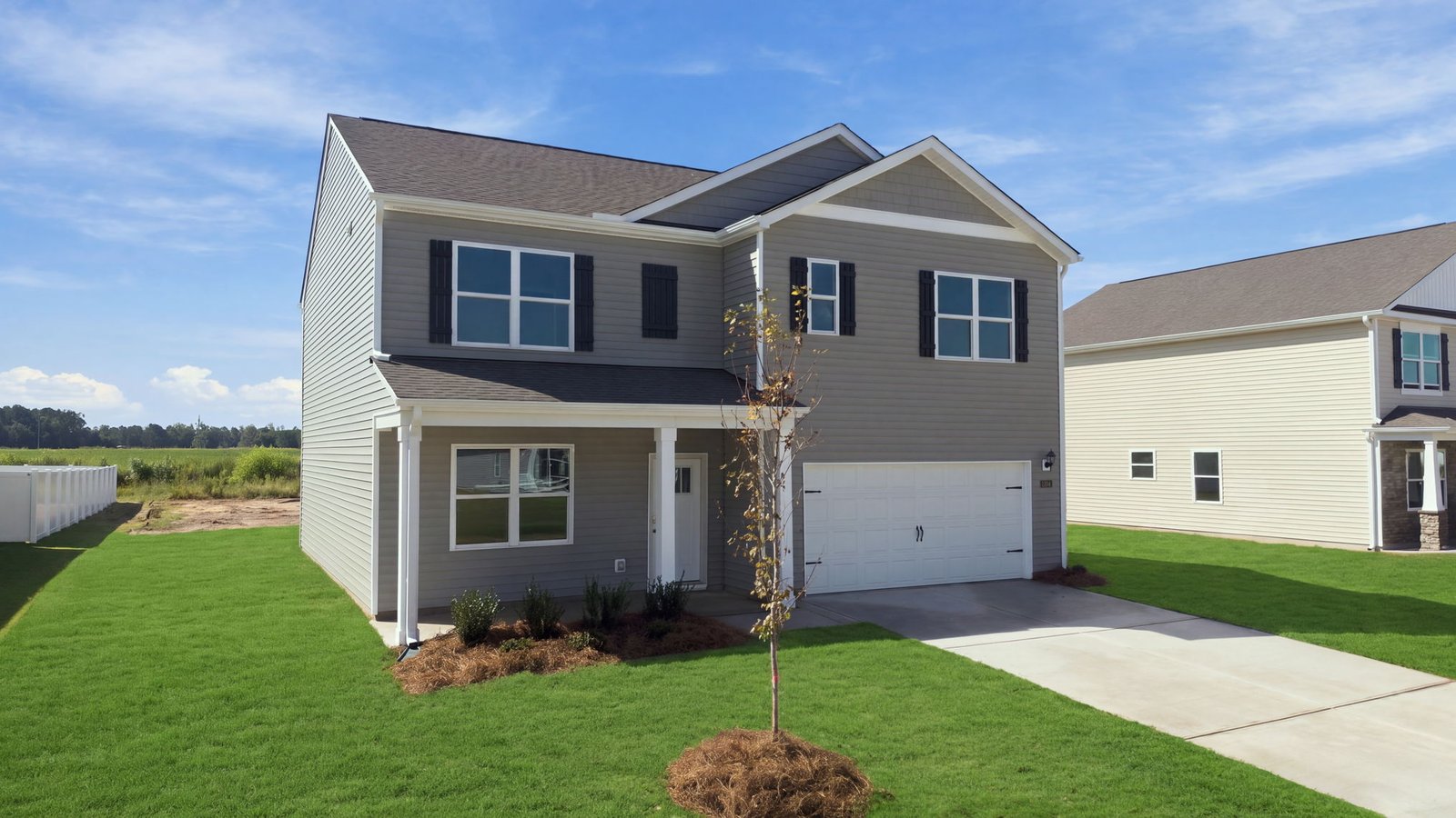 front view of two story home with two car garage
