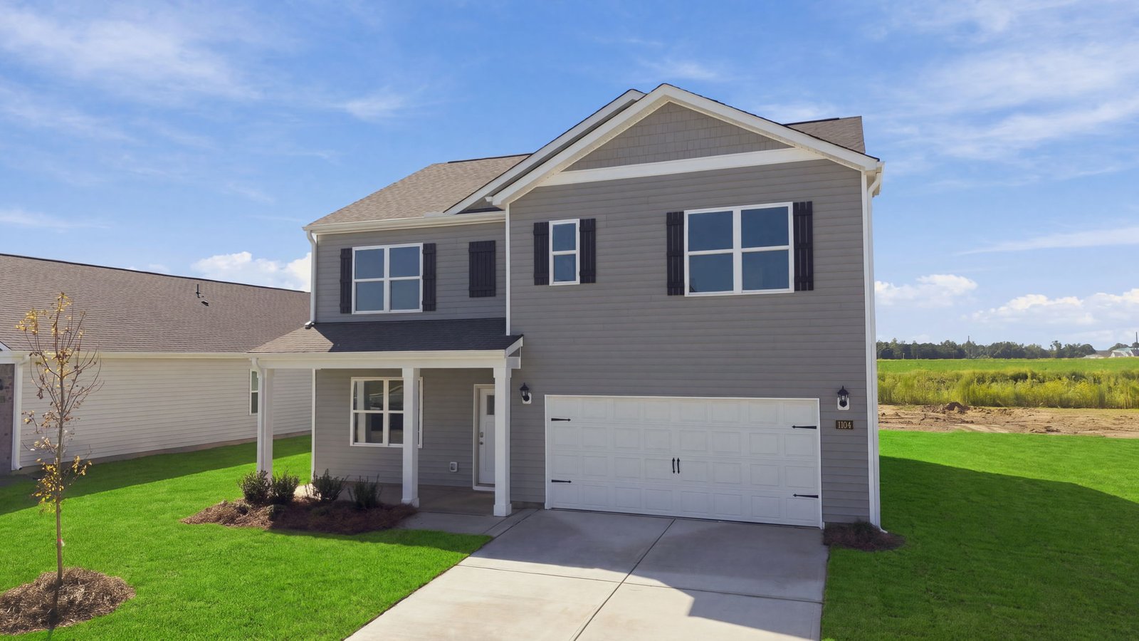 front view of two story home with two car garage