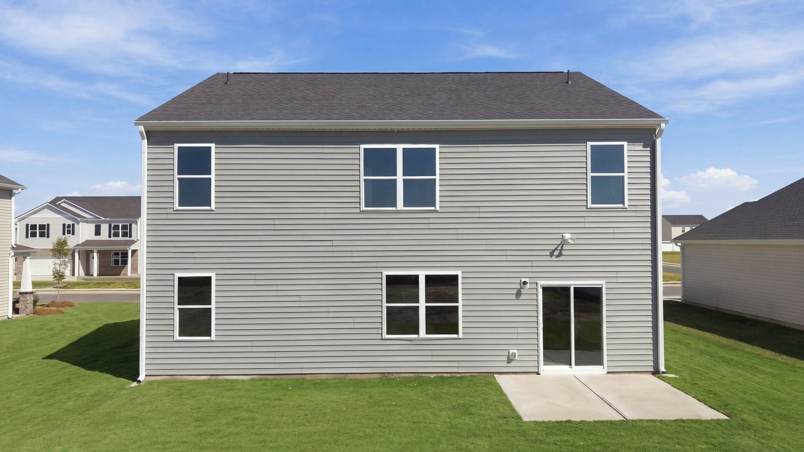 rear view of home and back patio pad