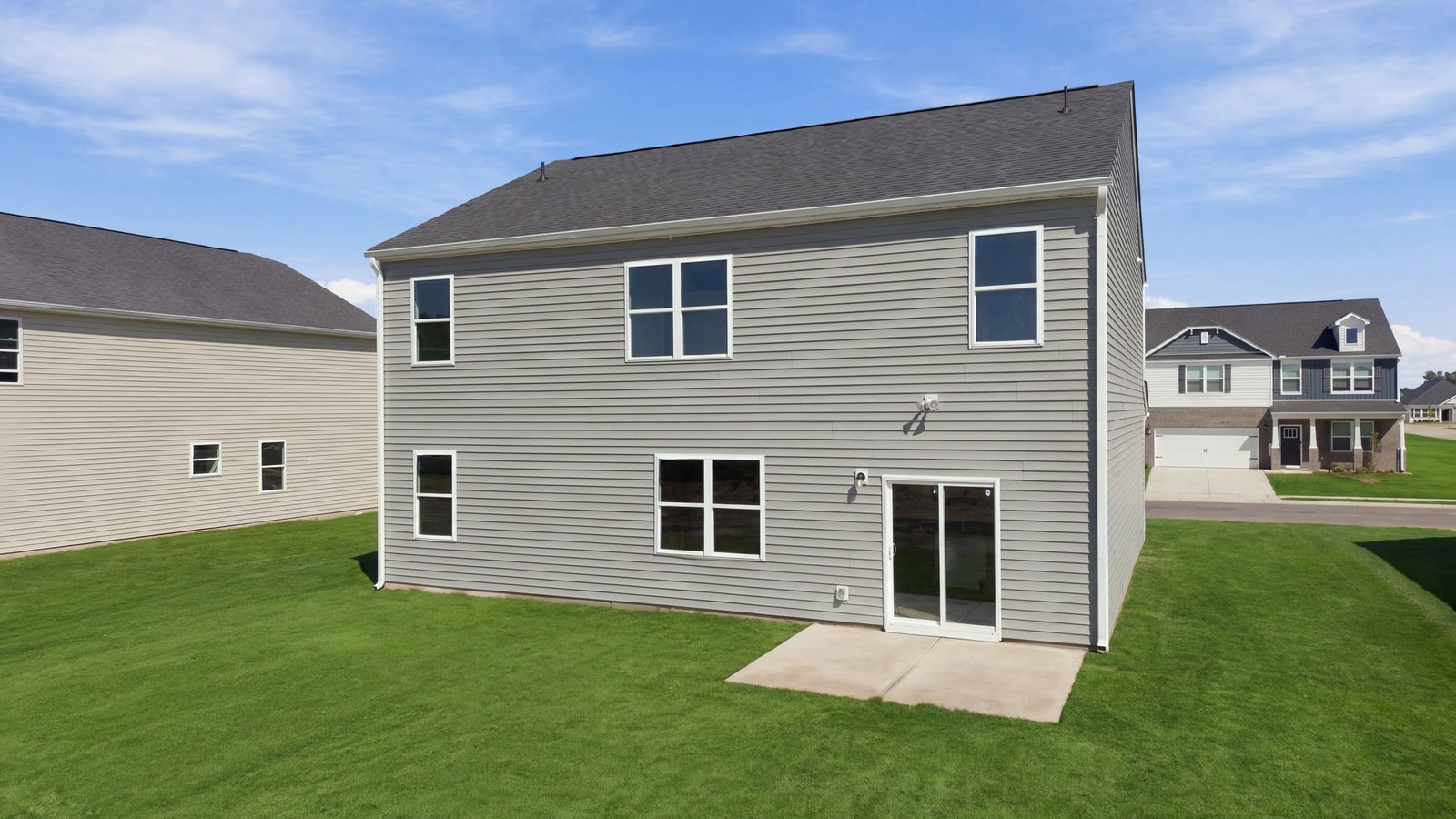 rear view of home and back patio pad