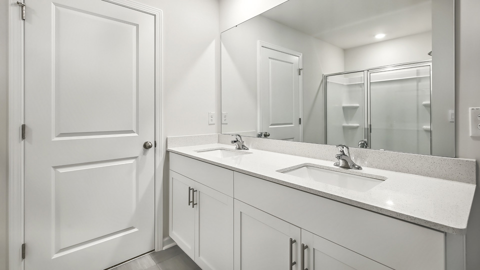 Bathroom with white cabinets