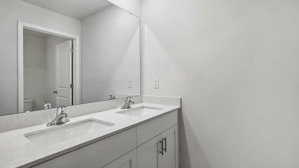 Bathroom with white cabinets
