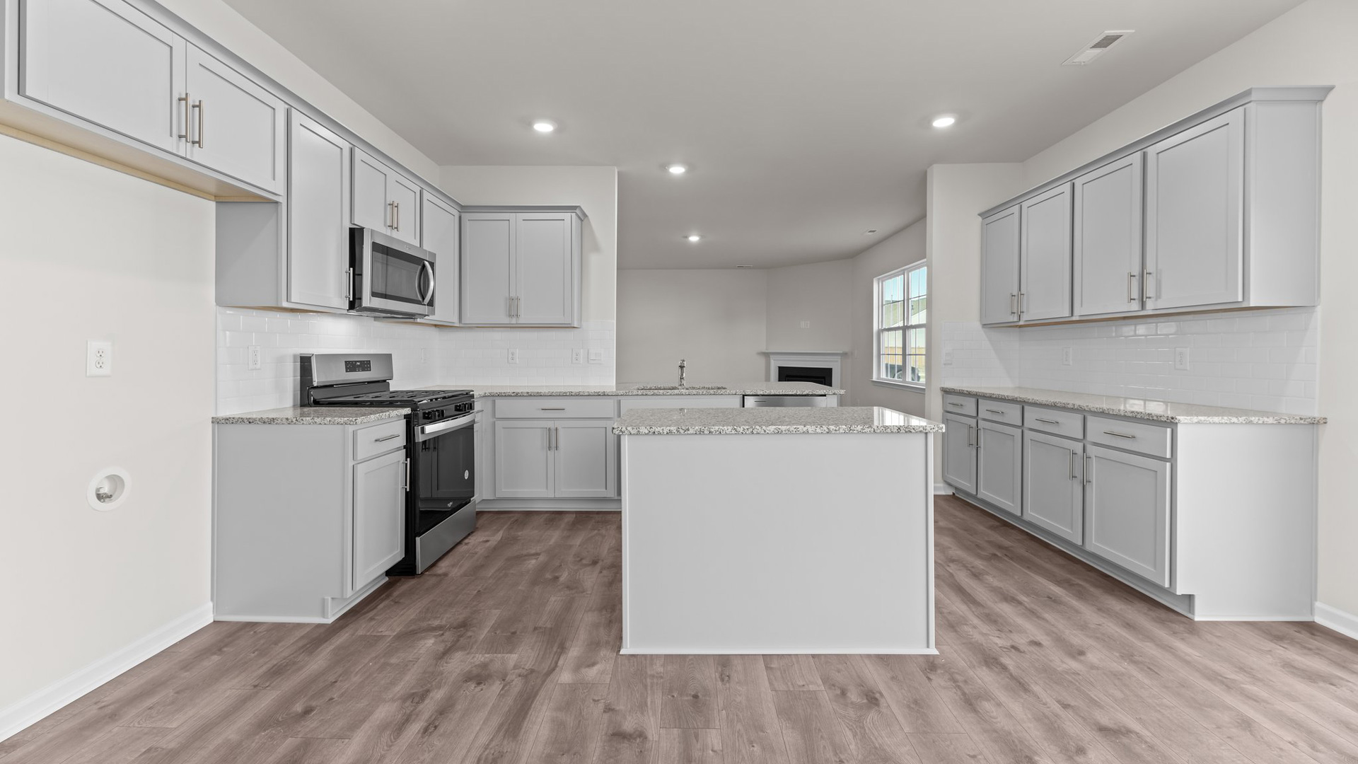 kitchen view with stainless steel appliances and island