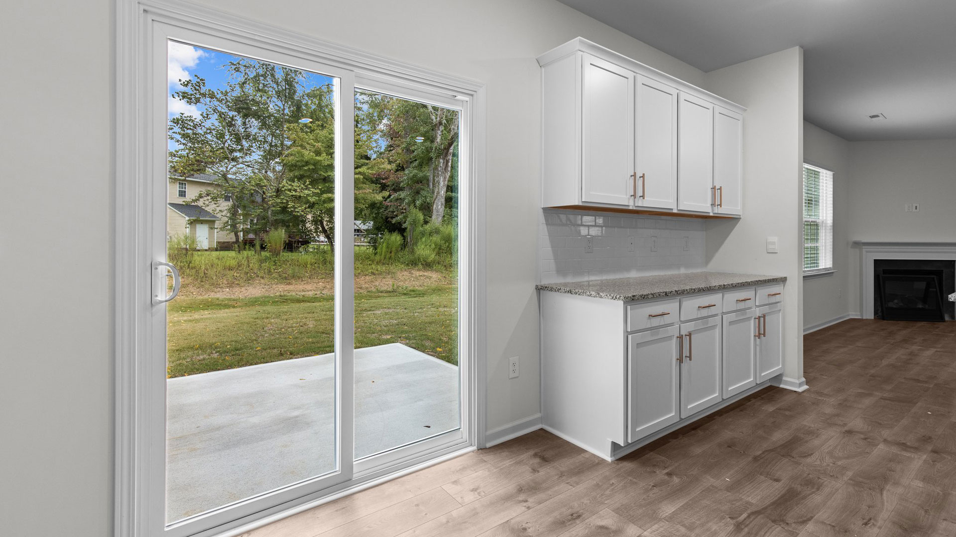 Large sliding glass door exiting to back patio