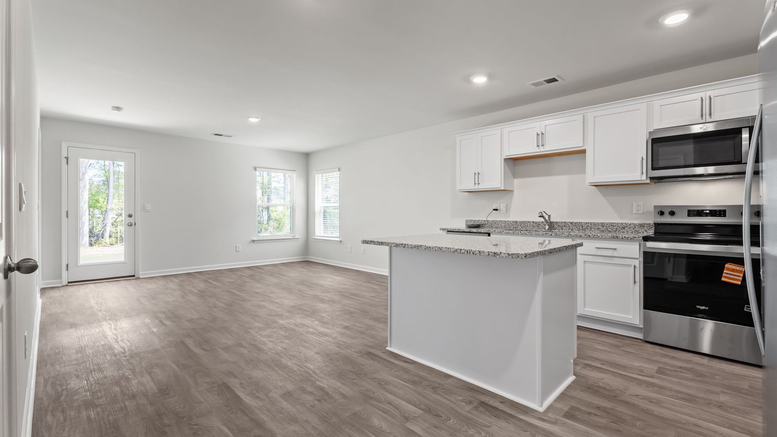 kitchen with large island and white cabinets