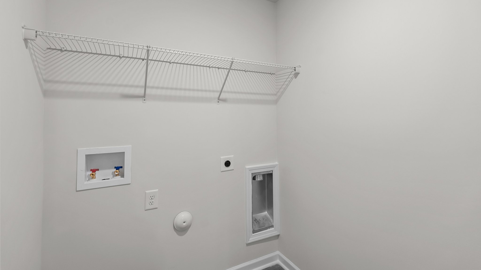 Laundry room with wire shelving