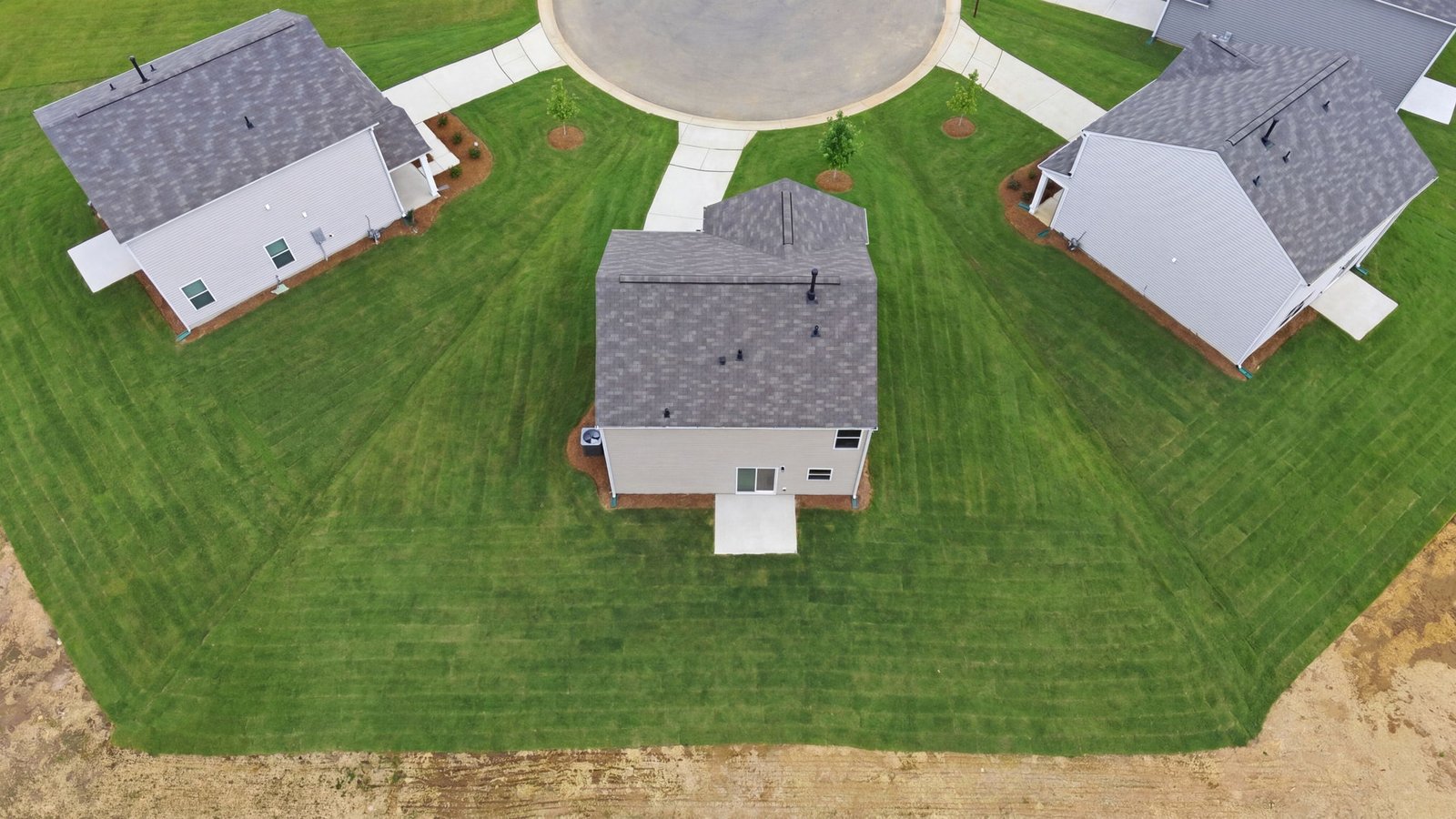 aerial view of the home and yard in neighborhood