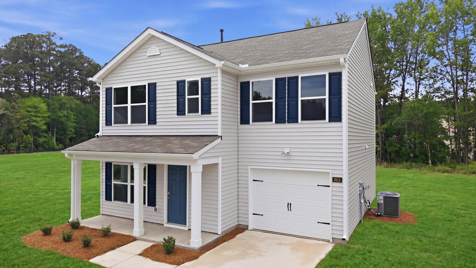 two story home with two car garage