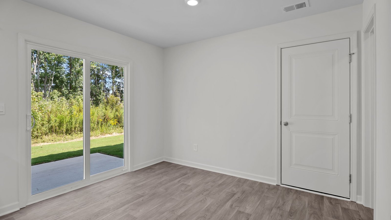 Open-concept dining area with sliding door