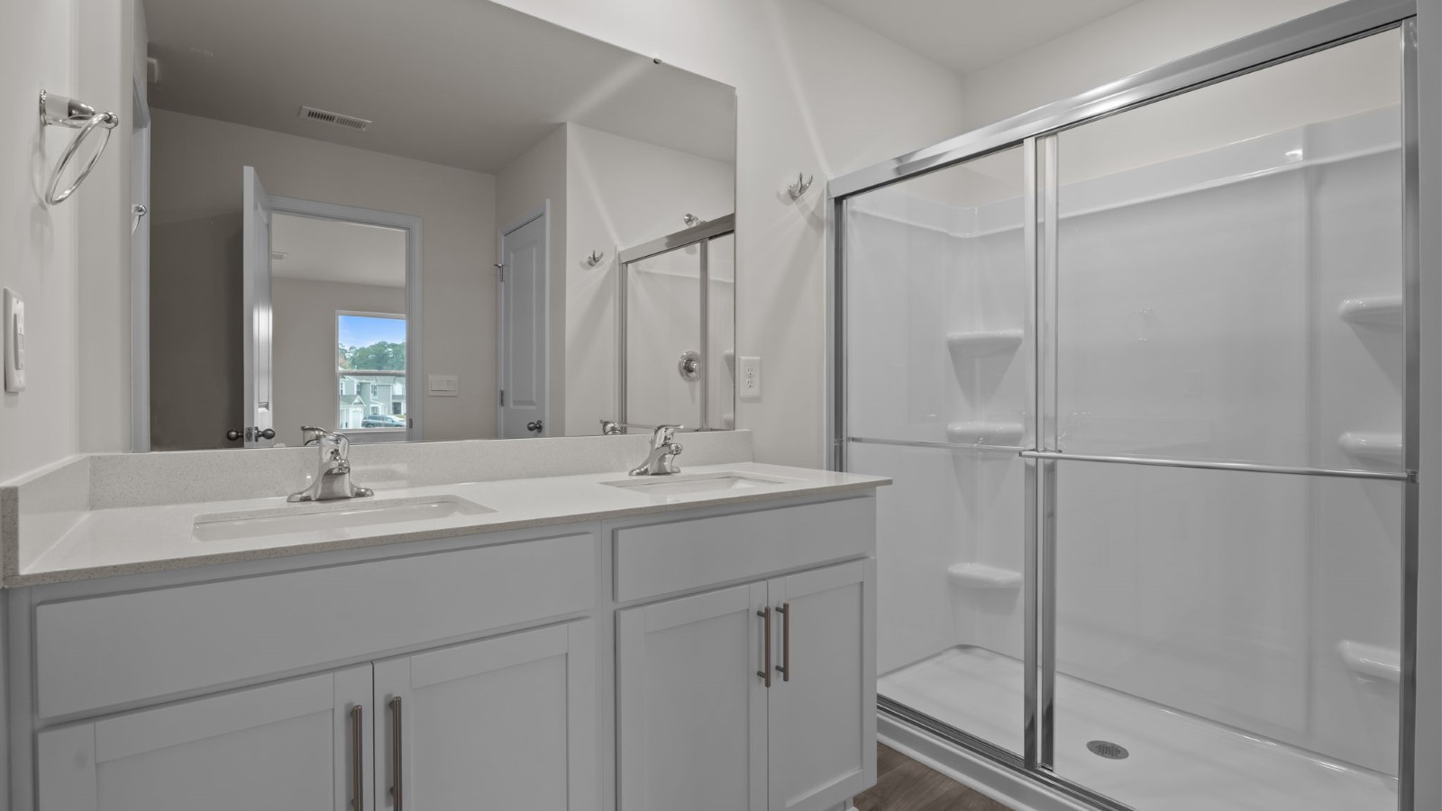 bathroom with white cabinets