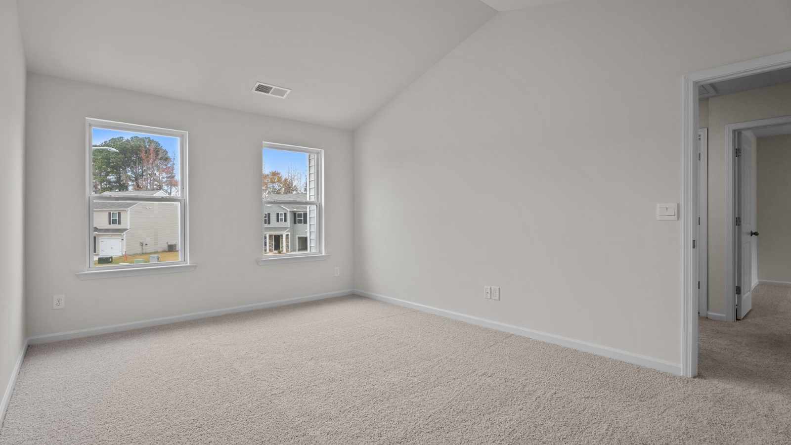 open space bedroom with high ceilings
