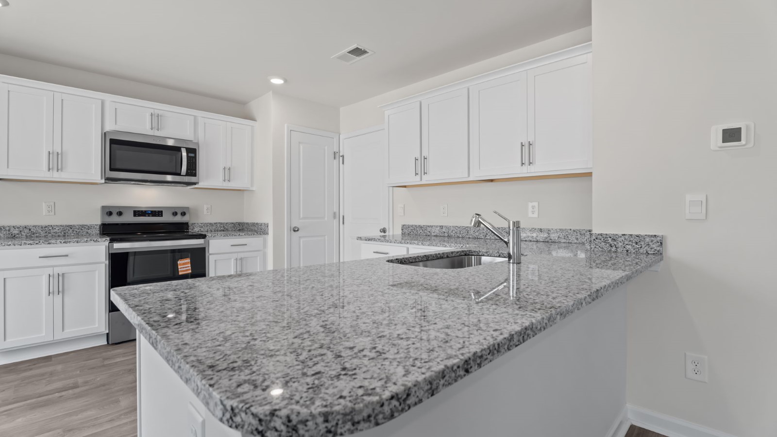 kitchen with quartz countertop and stainless steel appliances
