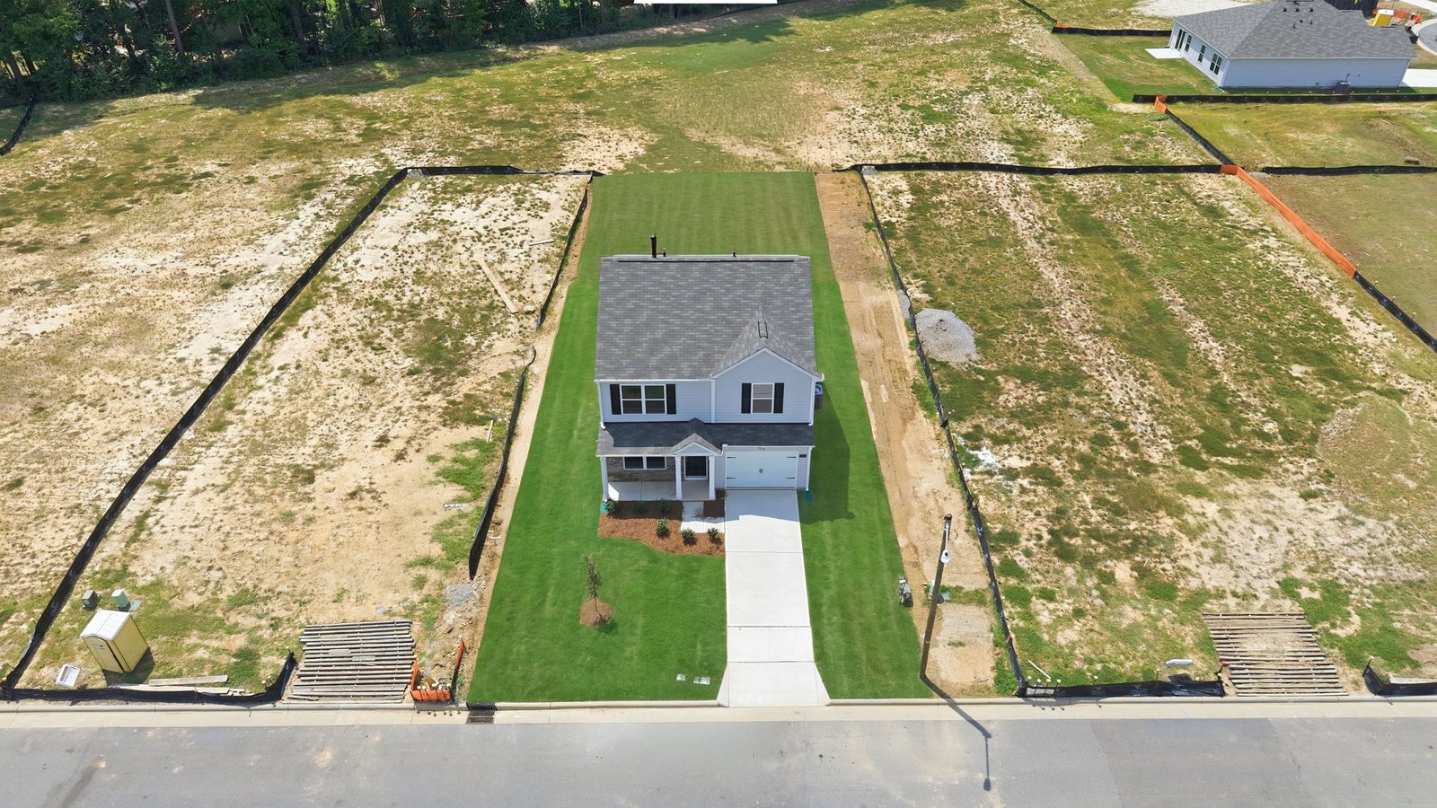 aerial view of home and lot