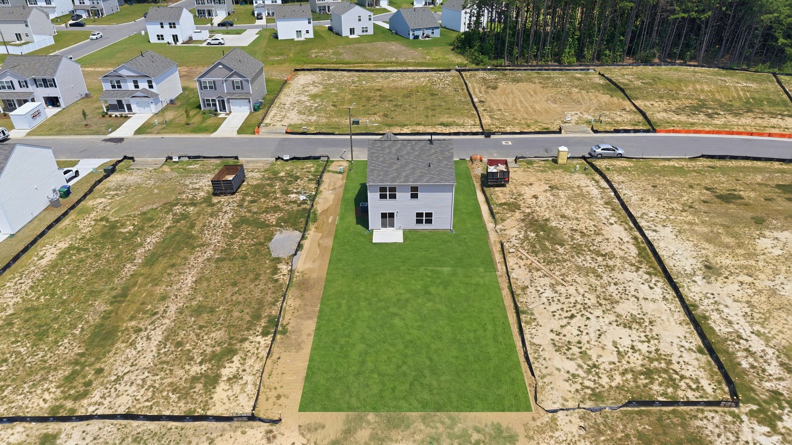 aerial view of home and lot