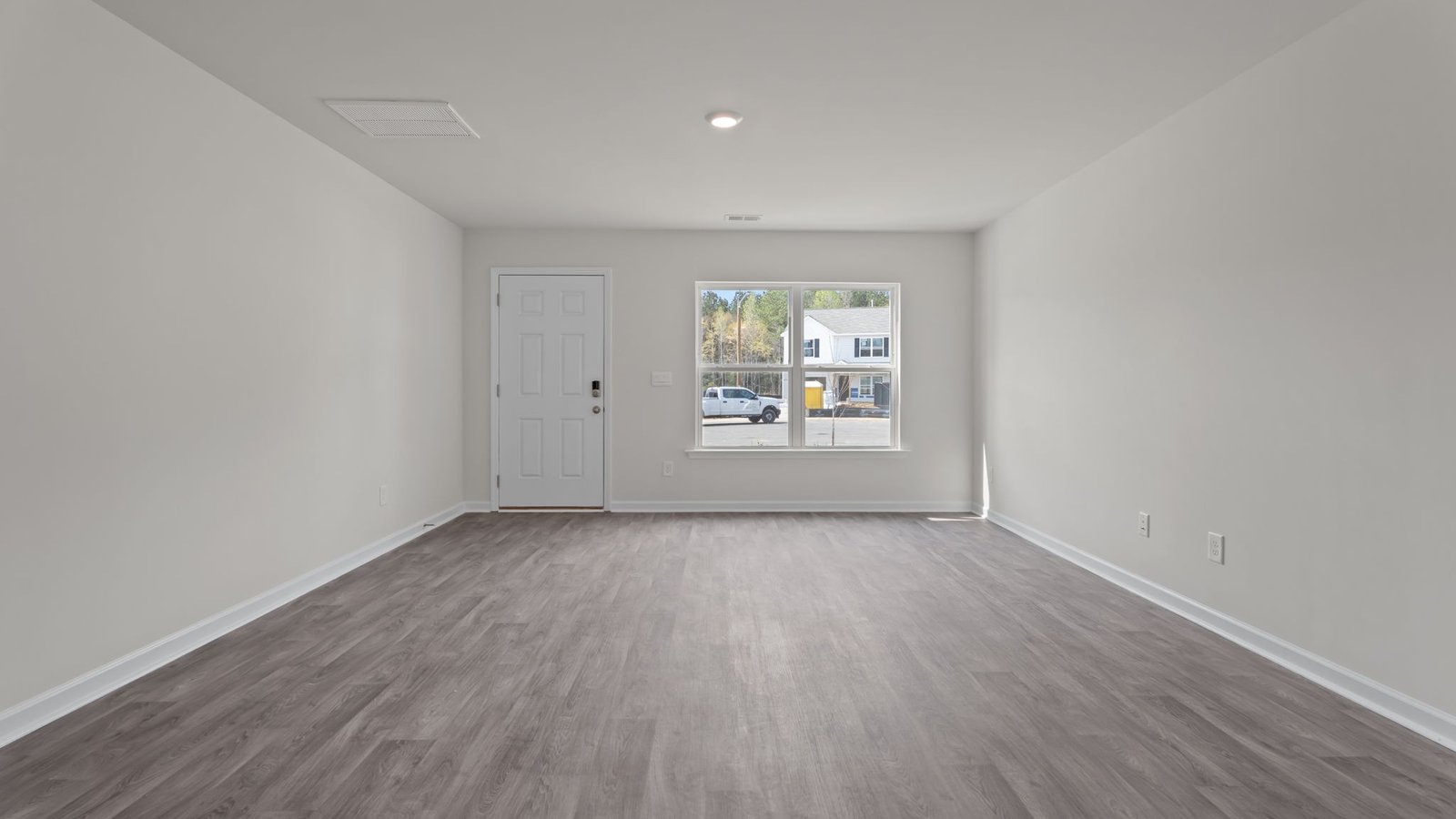 large living room with windows
