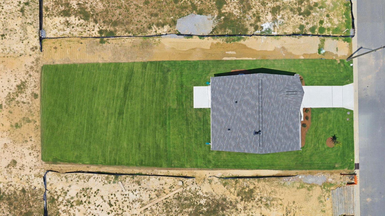 aerial view of home and lot