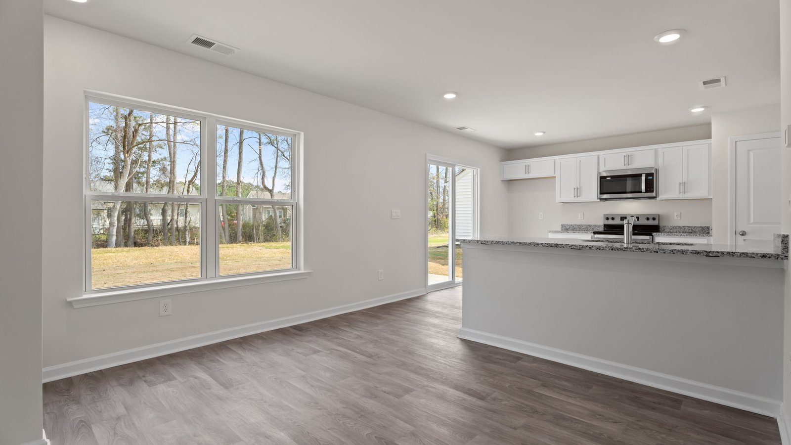 dining room and kitchen with lots of natural light