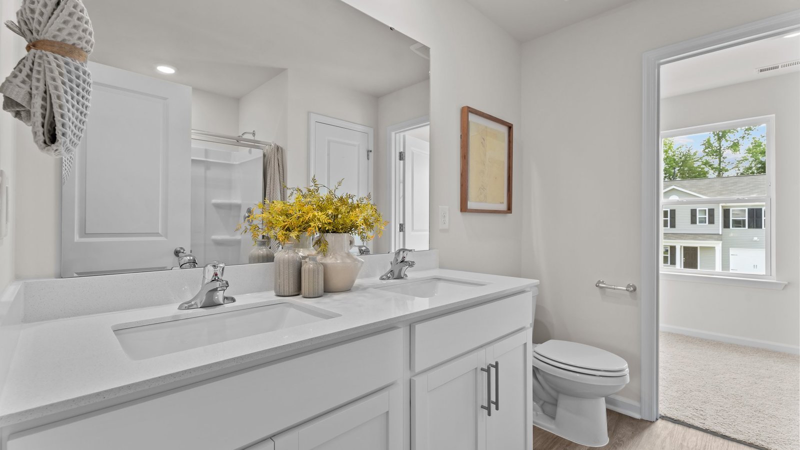 Primary bath with white cabinets