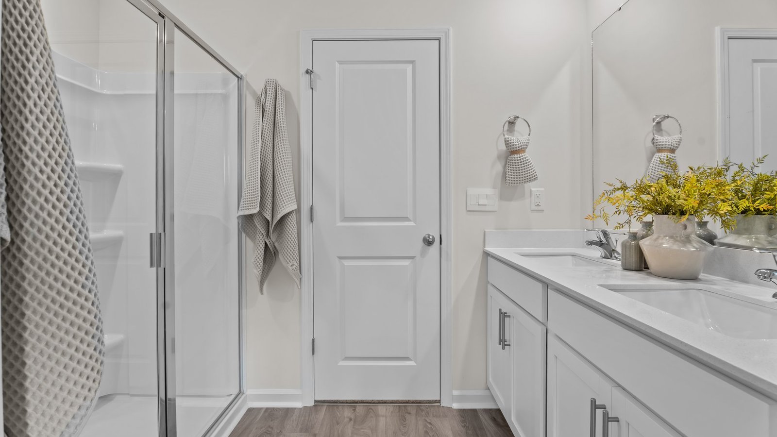 Bathroom view with white cabinets