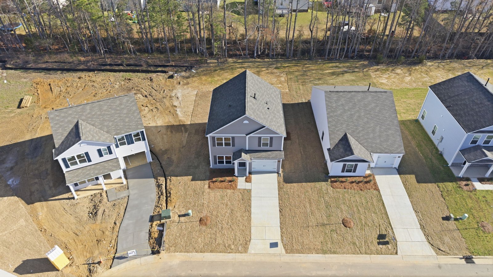 Aerial view of the home and the street of the home and back yard