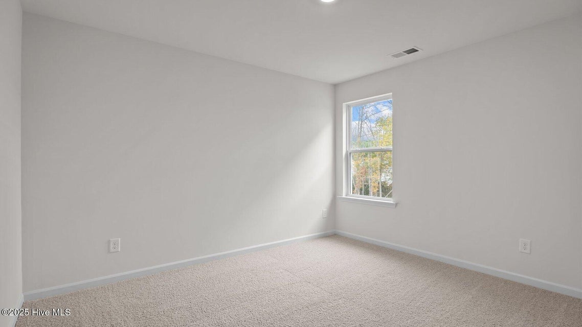 Bedroom with carpet flooring