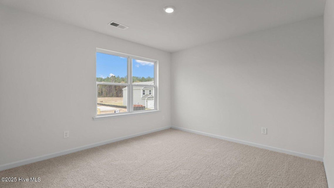 Bedroom with carpet flooring