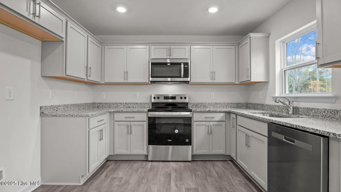 Kitchen with stainless-steel appliances