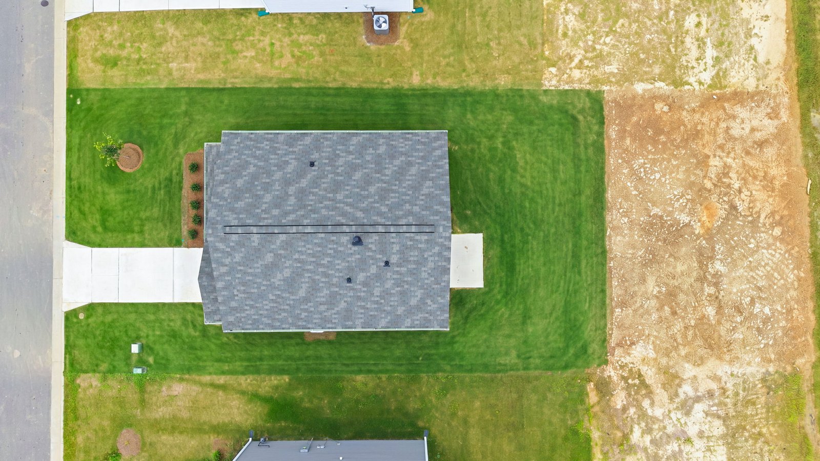 aerial view of home and lot