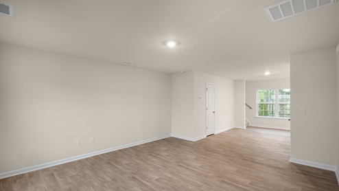 living area and entryway with white door