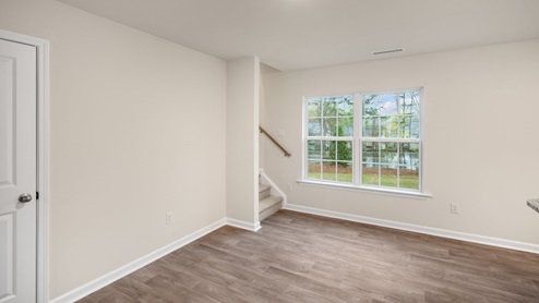 living area and entryway with white door