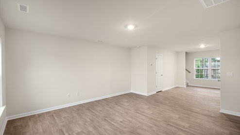 living area and entryway with white door