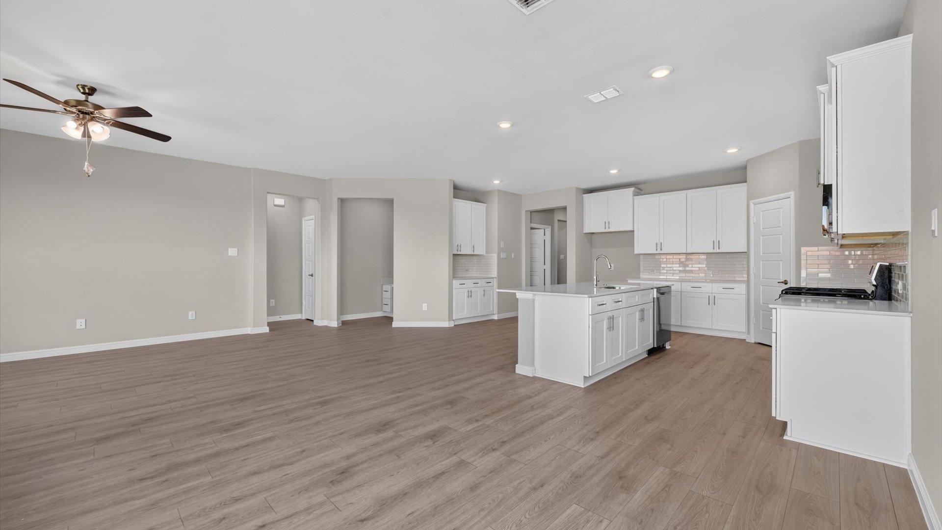 Open concept kitchen, living, and dining