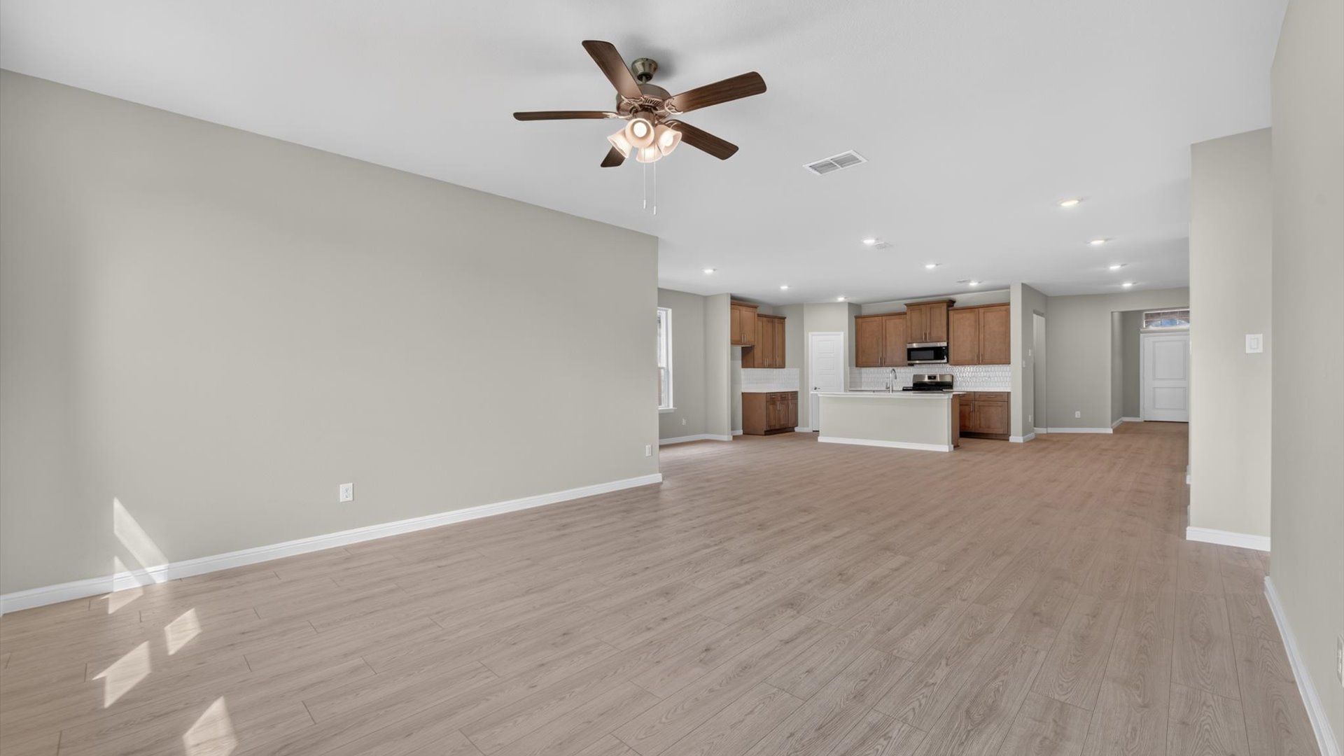 Open concept kitchen, living, and dining