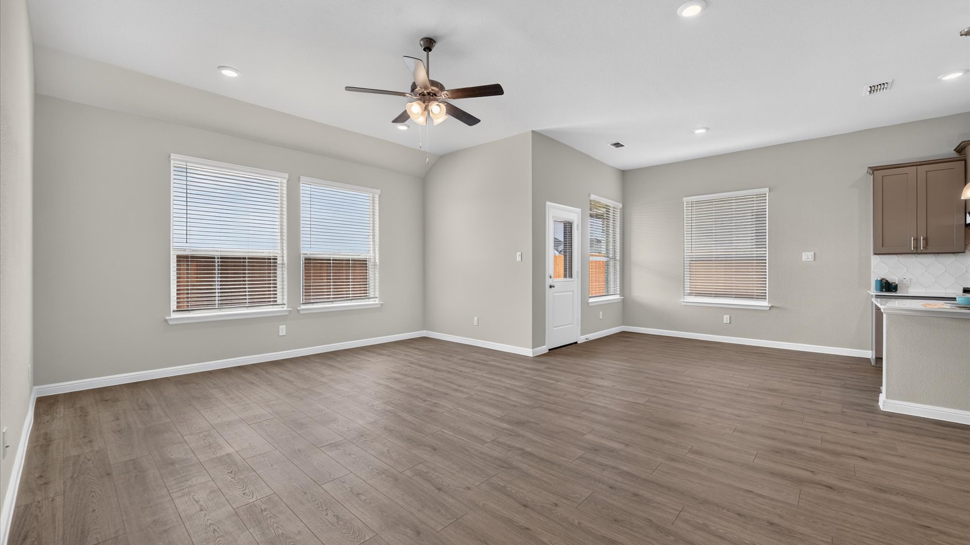 Open kitchen, dining, and living