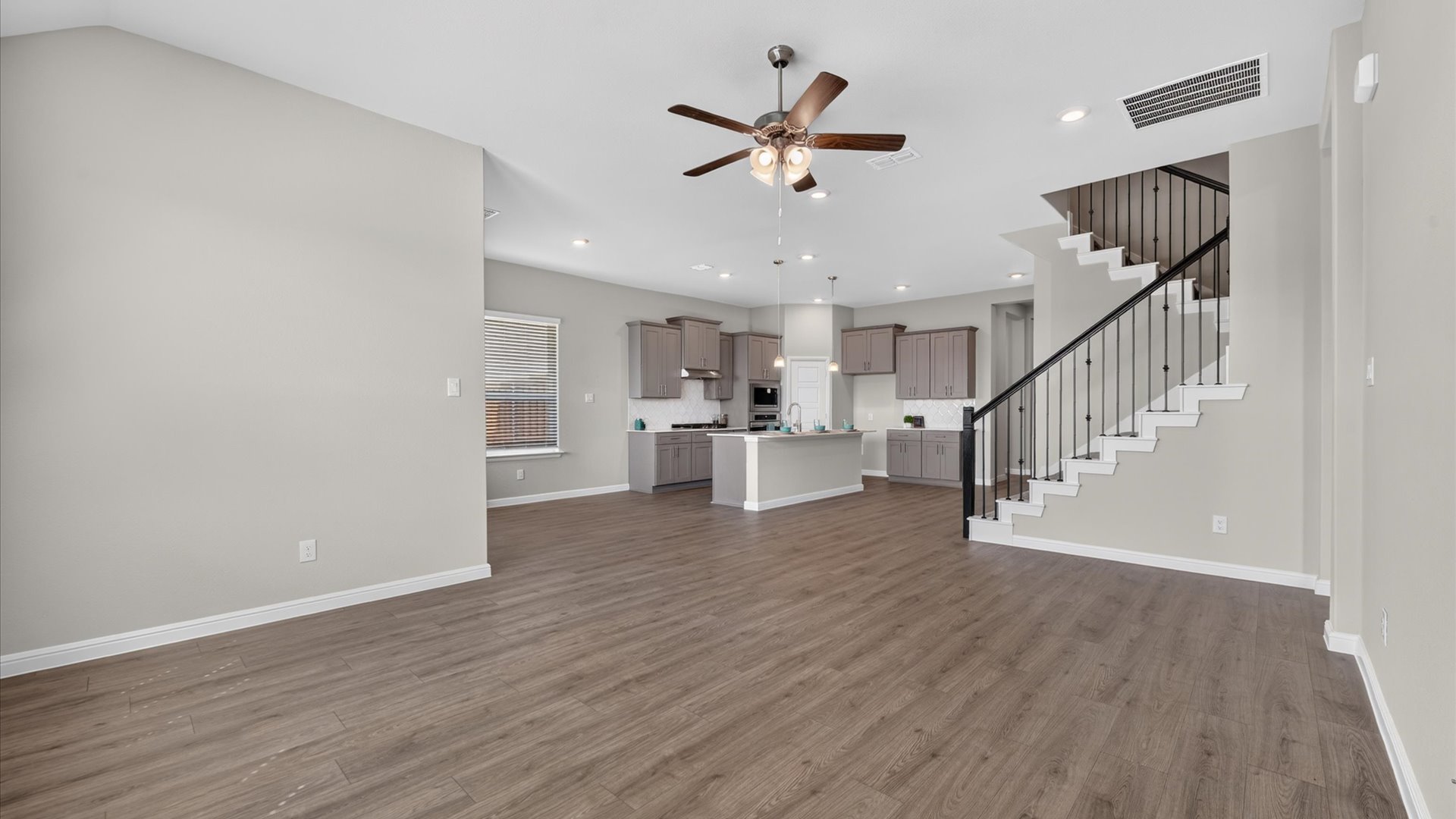Open concept kitchen, dining, and living