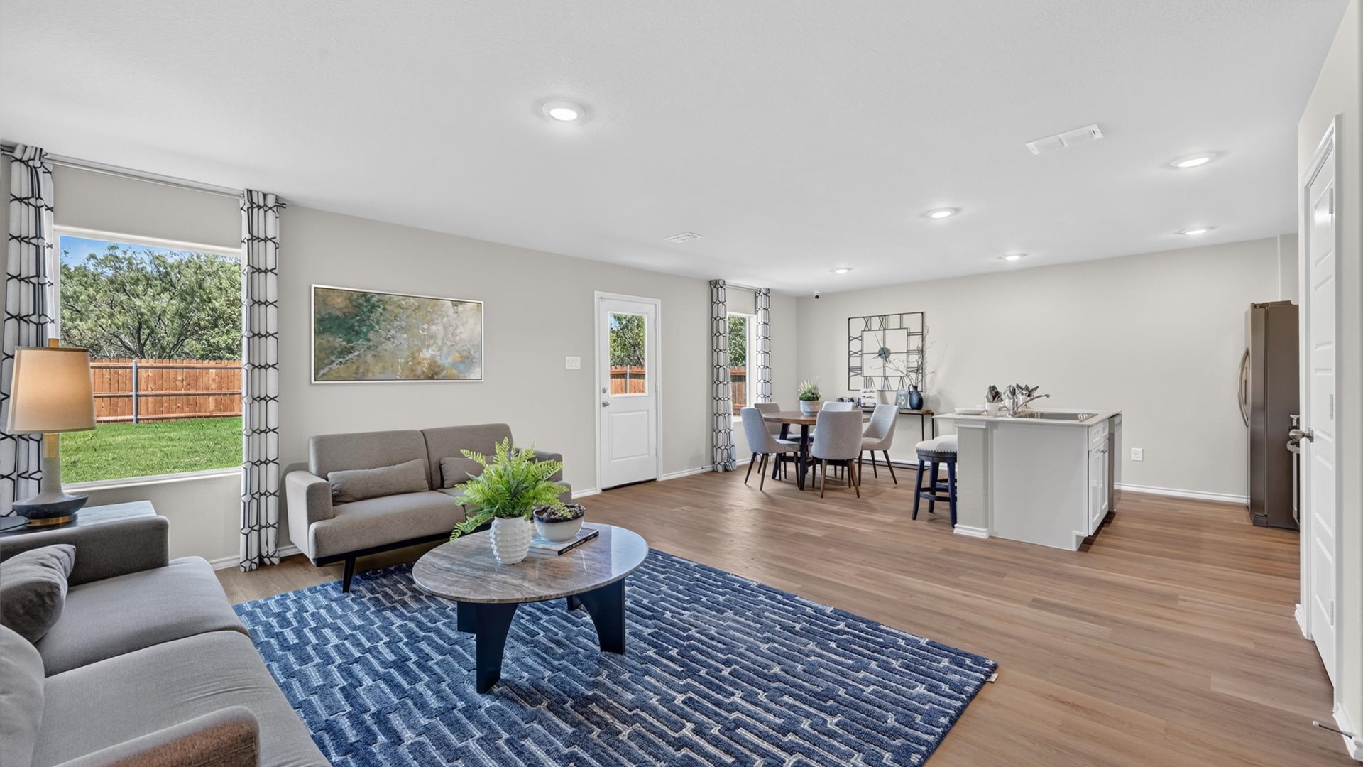 Open kitchen, dining, and living