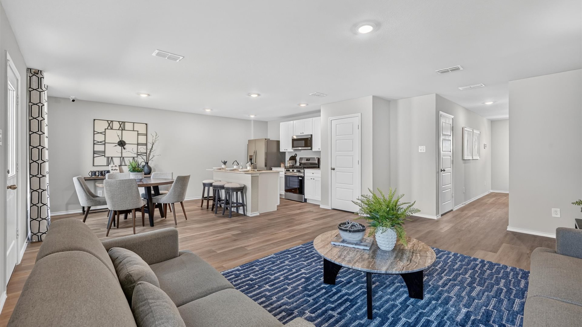 Open living, dining, and kitchen area