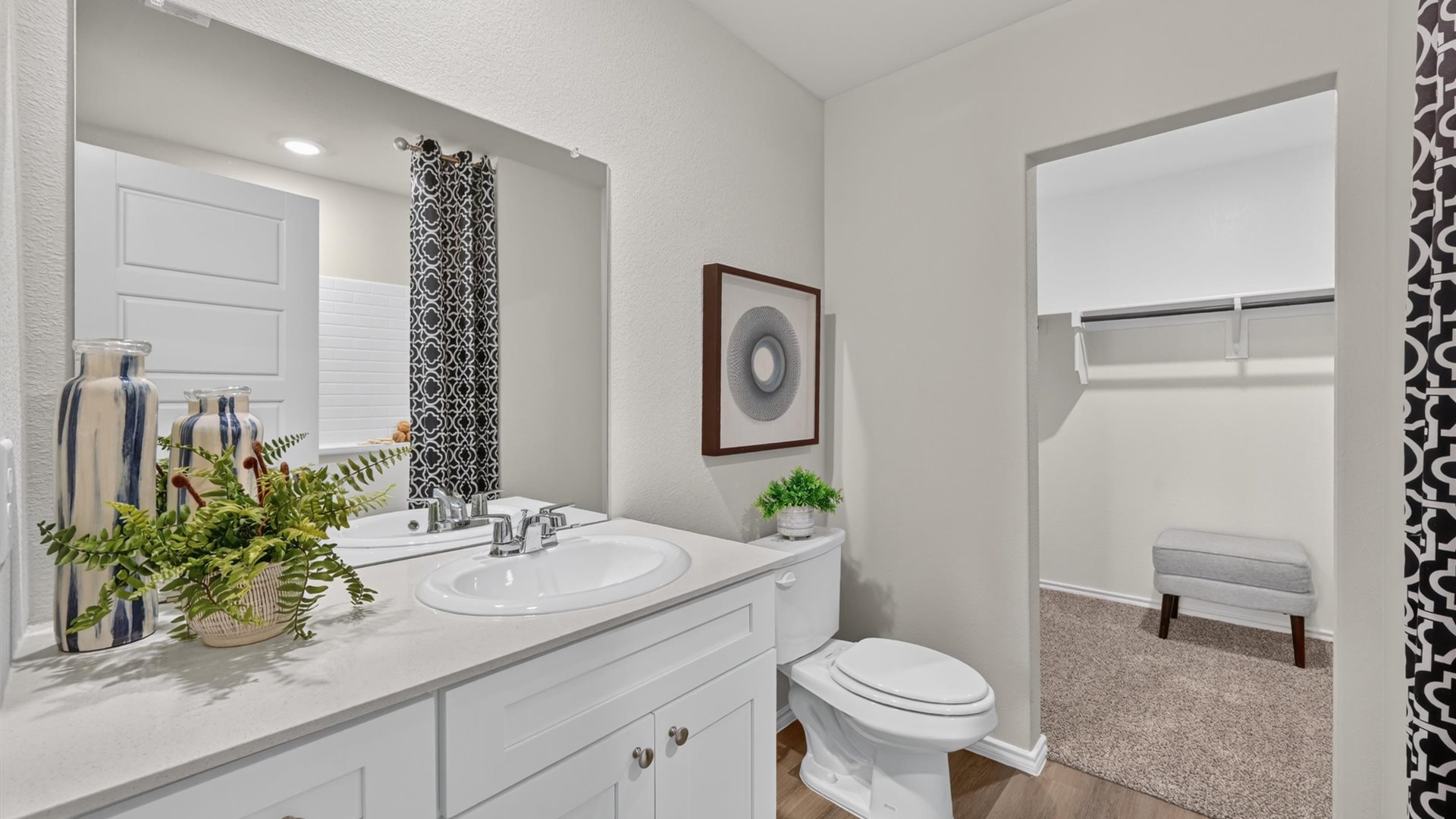 Bathroom 1 with spacious vanity and walk-in closet