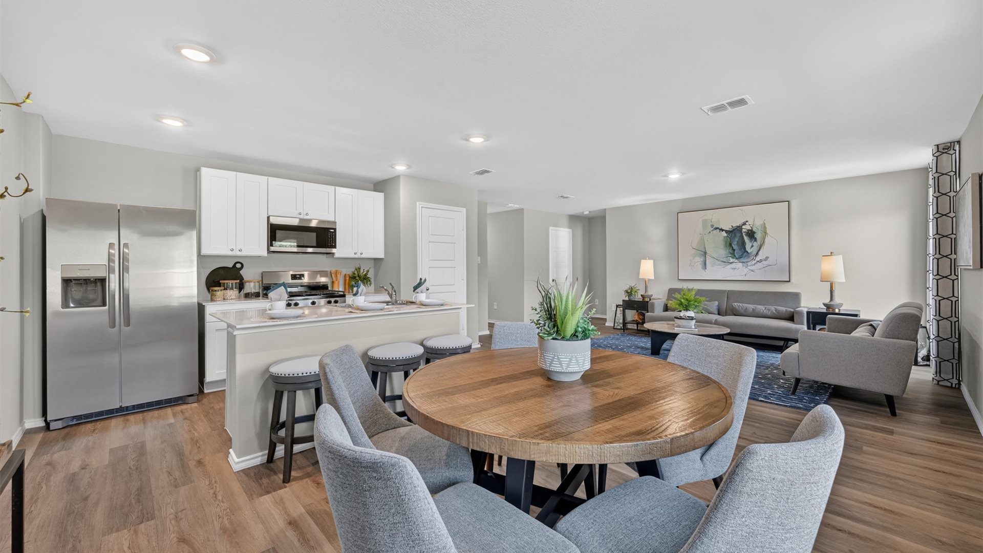 Open kitchen, dining, and living space
